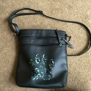Large black purse with cat paw